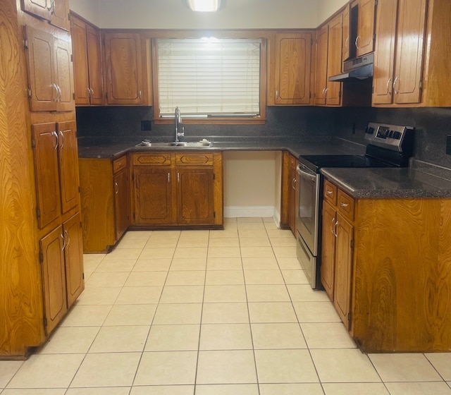 kitchen with stainless steel electric range oven, sink, tasteful backsplash, and light tile patterned floors