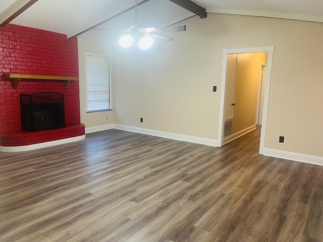 unfurnished living room with ceiling fan, hardwood / wood-style flooring, vaulted ceiling with beams, and a brick fireplace