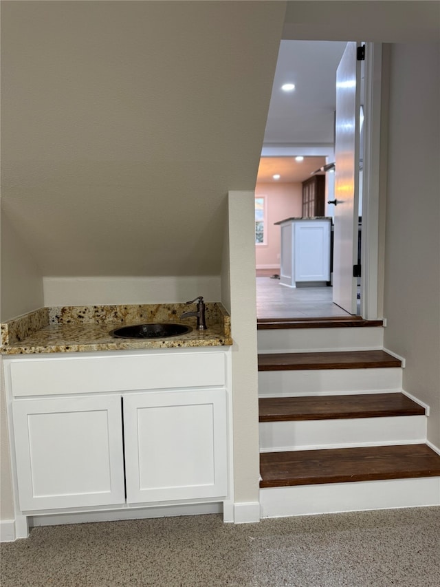 staircase with sink