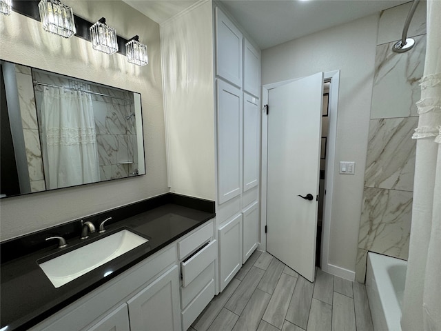 bathroom with vanity and tiled shower / bath combo