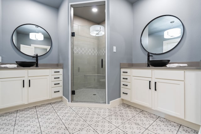 bathroom with vanity and an enclosed shower