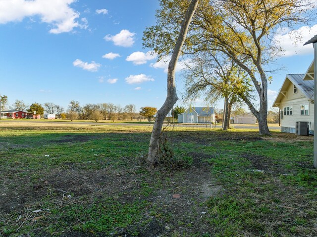 view of yard featuring central AC