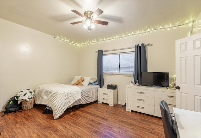 bedroom featuring dark hardwood / wood-style flooring and ceiling fan