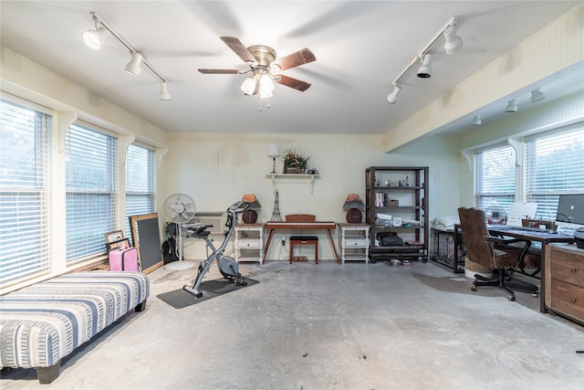 office area with ceiling fan, a healthy amount of sunlight, and rail lighting