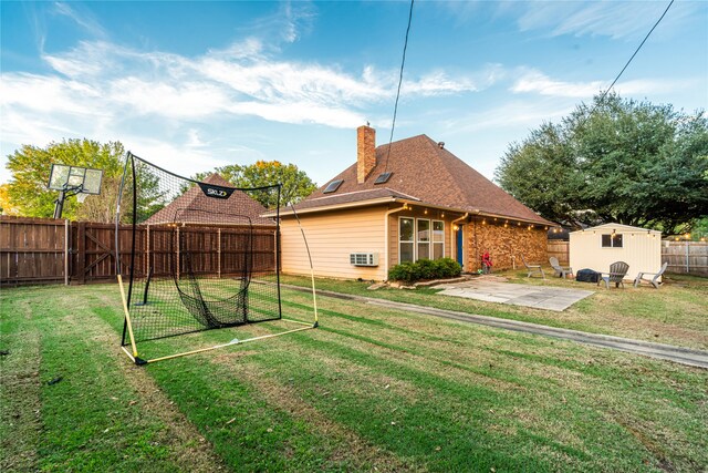 view of yard with a patio area and a storage shed