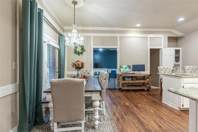 dining room featuring dark hardwood / wood-style flooring and a notable chandelier