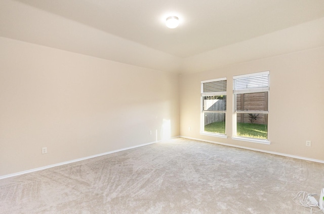 empty room featuring light carpet