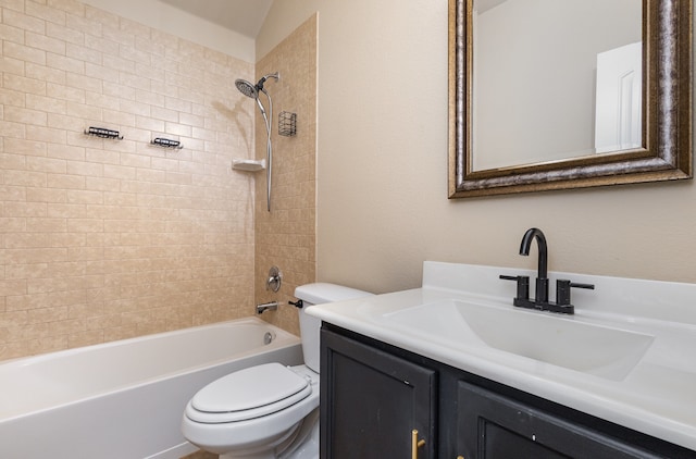 full bathroom with vanity, toilet, and tiled shower / bath