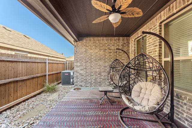 view of patio / terrace with ceiling fan and central AC unit