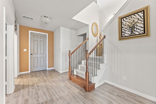 foyer with light wood-type flooring