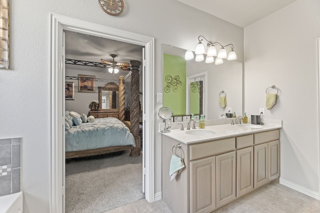 bathroom featuring vanity, tile patterned flooring, and ceiling fan