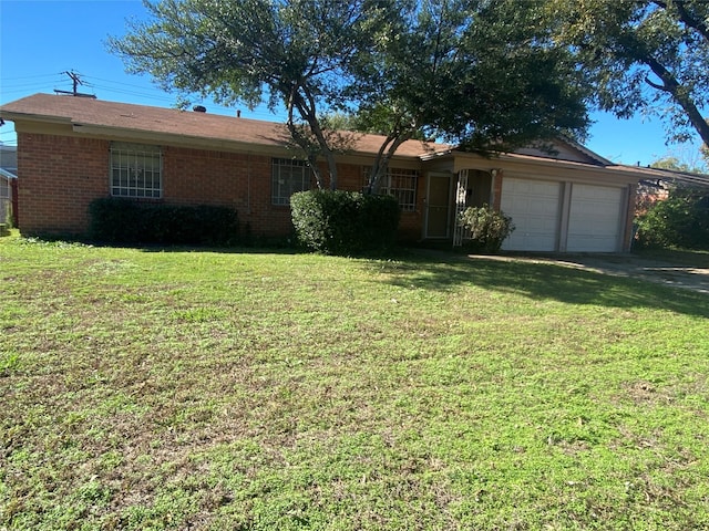 single story home with a front yard and a garage