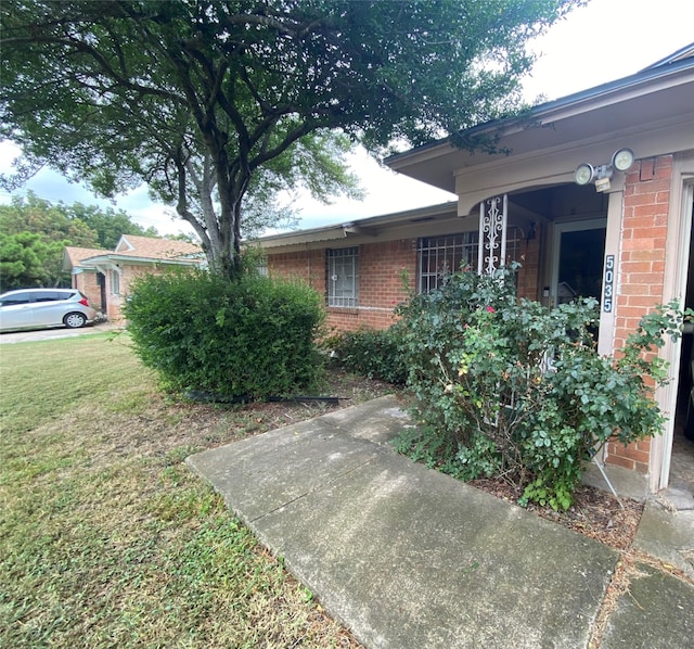 view of home's exterior featuring a yard