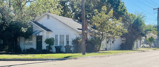 view of property exterior featuring a yard