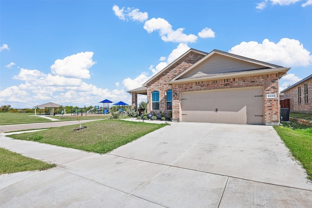 view of front of home with a garage and a front yard