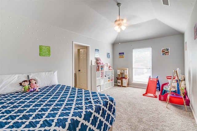 carpeted bedroom with vaulted ceiling and ceiling fan