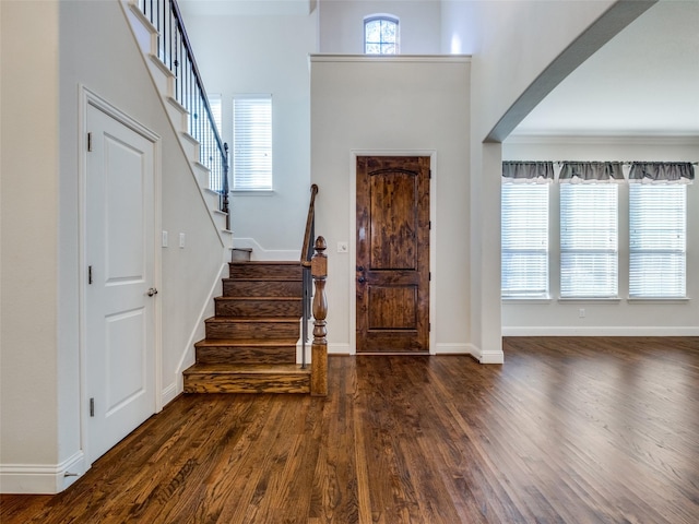 entryway with dark hardwood / wood-style floors