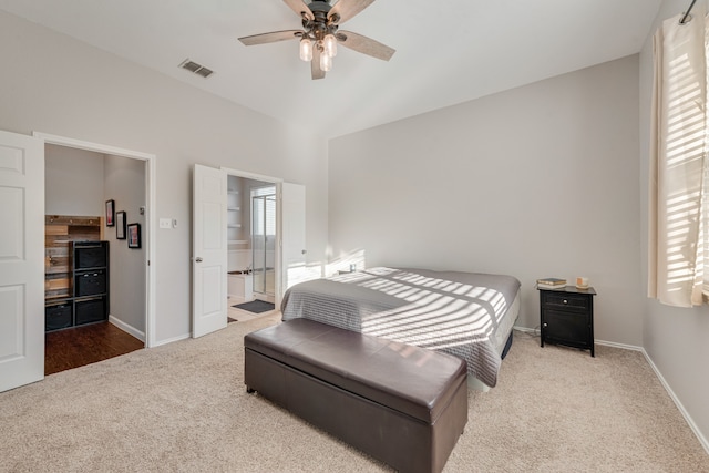 carpeted bedroom with multiple windows, vaulted ceiling, and ceiling fan