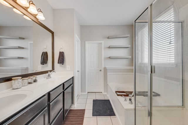 bathroom featuring tile patterned flooring, vanity, and shower with separate bathtub