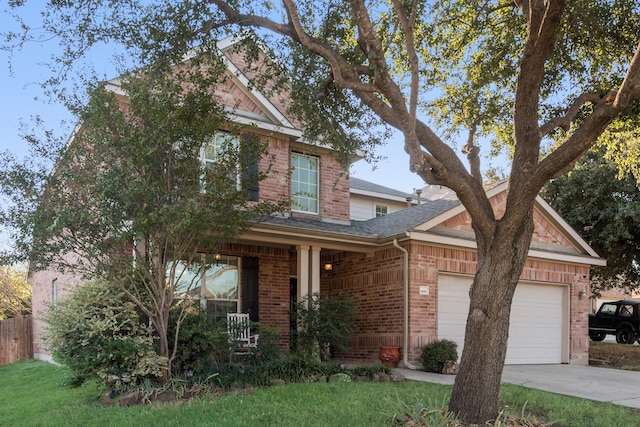 view of front of house with covered porch and a garage