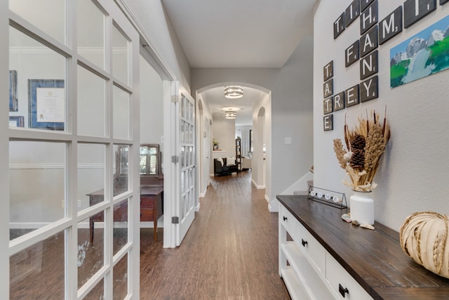 corridor featuring french doors and dark wood-type flooring