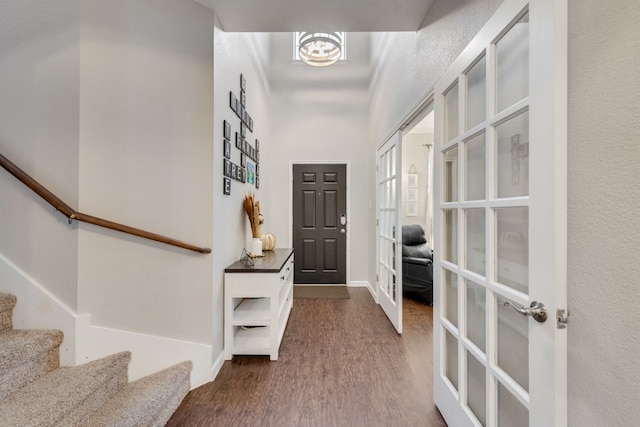 foyer with hardwood / wood-style floors and french doors