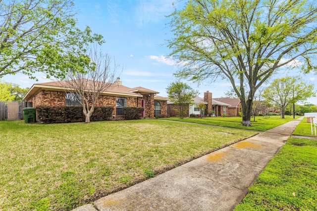 single story home with a front yard