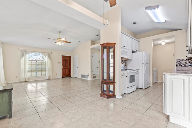 kitchen with lofted ceiling, tasteful backsplash, light tile patterned flooring, white cabinetry, and white appliances