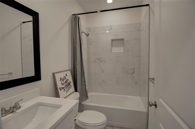 full bathroom with shower / bath combo, vanity, and toilet