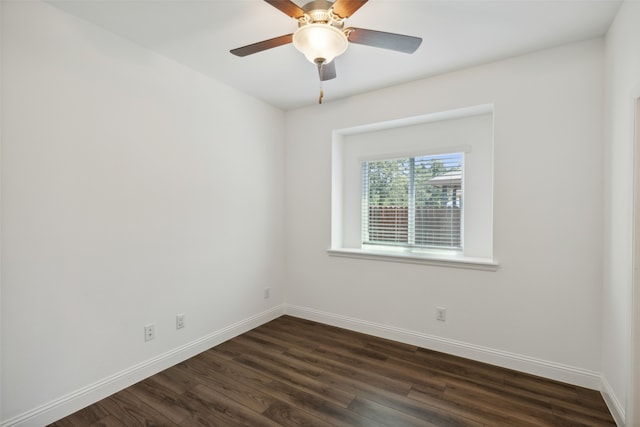 unfurnished room with ceiling fan and dark hardwood / wood-style floors