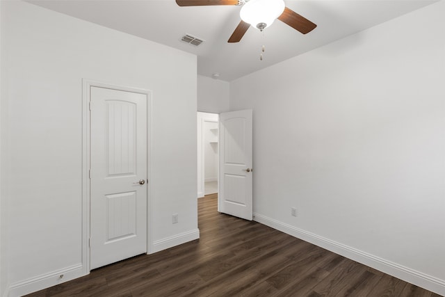 unfurnished bedroom with dark wood-type flooring and ceiling fan