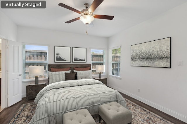 bedroom with ceiling fan and dark hardwood / wood-style floors