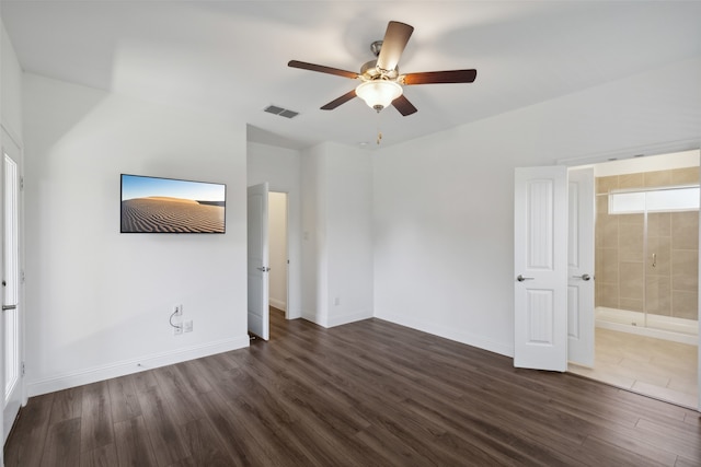 unfurnished bedroom with ceiling fan, ensuite bath, and dark hardwood / wood-style flooring