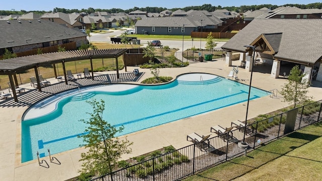 view of swimming pool with a yard and a patio area