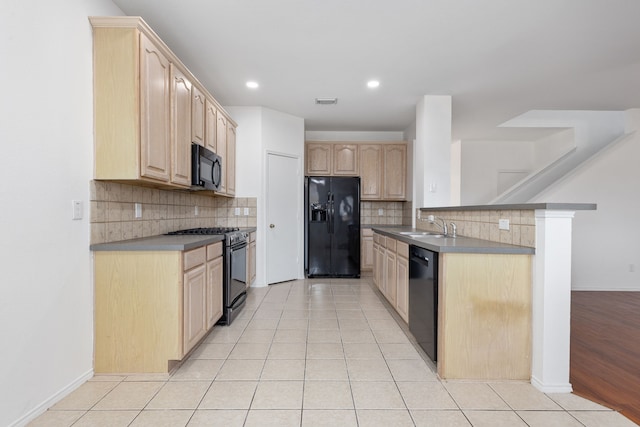 kitchen featuring kitchen peninsula, sink, black appliances, light brown cabinets, and light hardwood / wood-style flooring