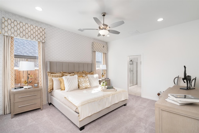 bedroom with multiple windows, light carpet, and ceiling fan