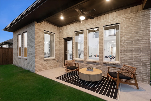 view of patio featuring ceiling fan