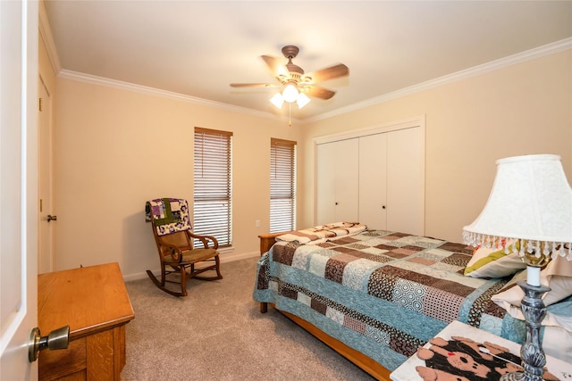 bedroom featuring ceiling fan, carpet, a closet, and ornamental molding