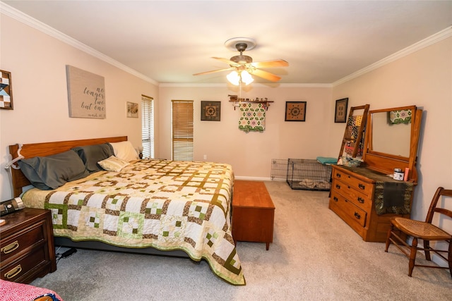 carpeted bedroom featuring ceiling fan and ornamental molding