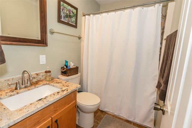 bathroom with toilet and vanity