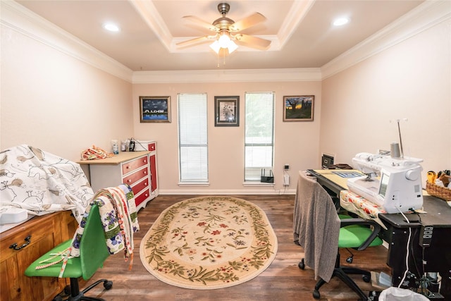 office space with dark hardwood / wood-style flooring, ornamental molding, and a tray ceiling