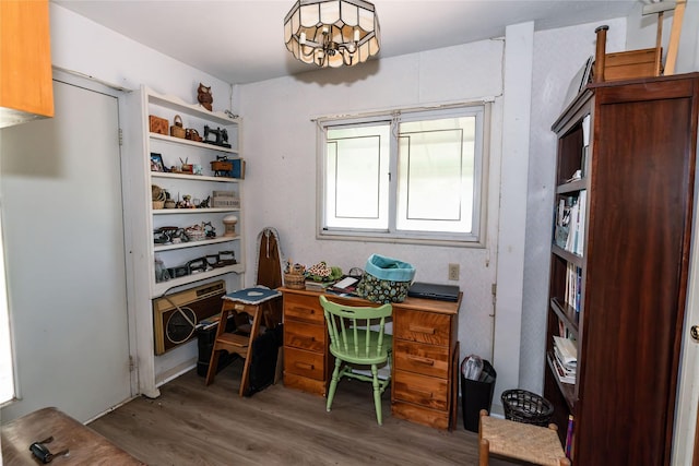 office space featuring a chandelier and hardwood / wood-style flooring