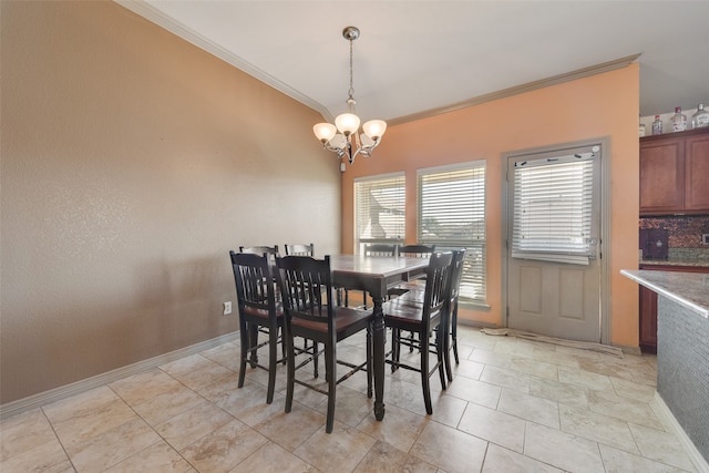 dining room featuring an inviting chandelier and ornamental molding