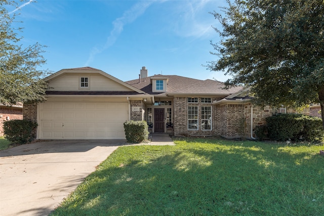 view of front facade featuring a front lawn and a garage