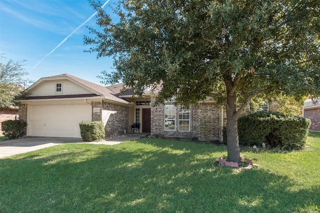 view of front of house with a garage and a front lawn