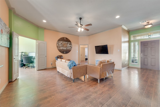 living room with ceiling fan, wood-type flooring, and crown molding