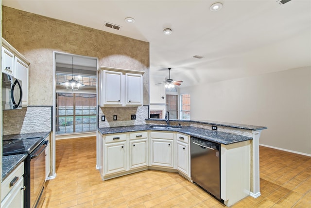 kitchen featuring ceiling fan, sink, light hardwood / wood-style flooring, decorative light fixtures, and appliances with stainless steel finishes