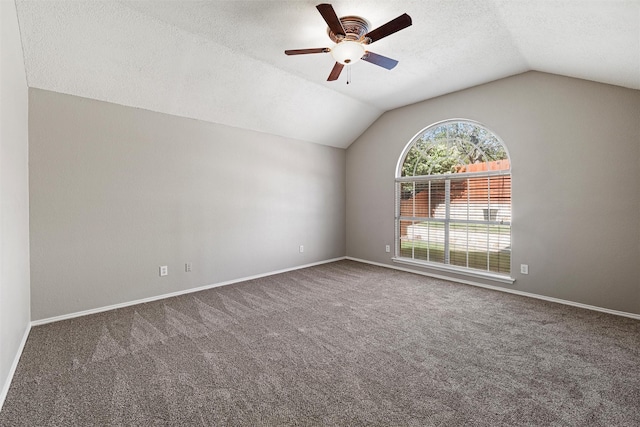 4721 Layla Rd, Arlington, TX 76016 - spare room featuring lofted ceiling, a ceiling fan, carpet, a textured ceiling, and baseboards