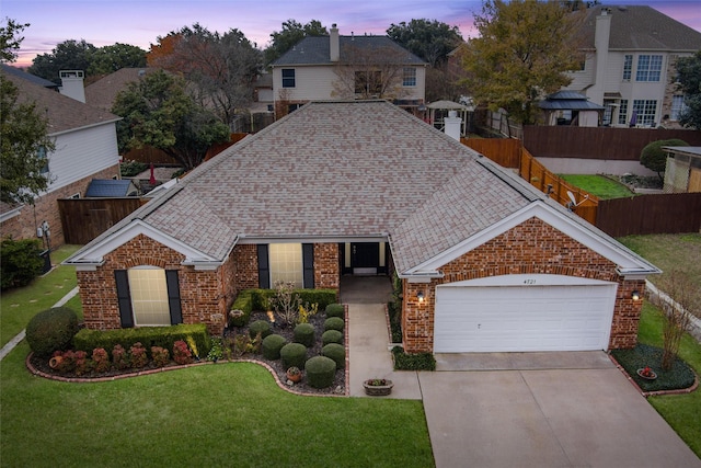 4721 Layla Rd, Arlington, TX 76016 - view of front of home with brick siding, driveway, a garage, and roof with shingles