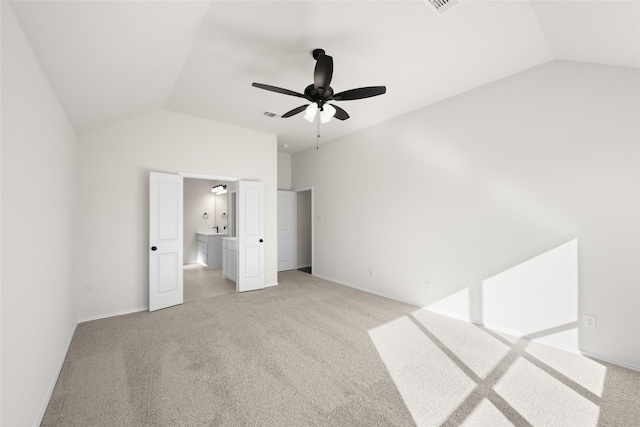 unfurnished bedroom with lofted ceiling, light colored carpet, and ceiling fan